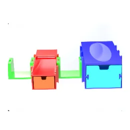 A group of small coloured rendered holders arranged as a set.